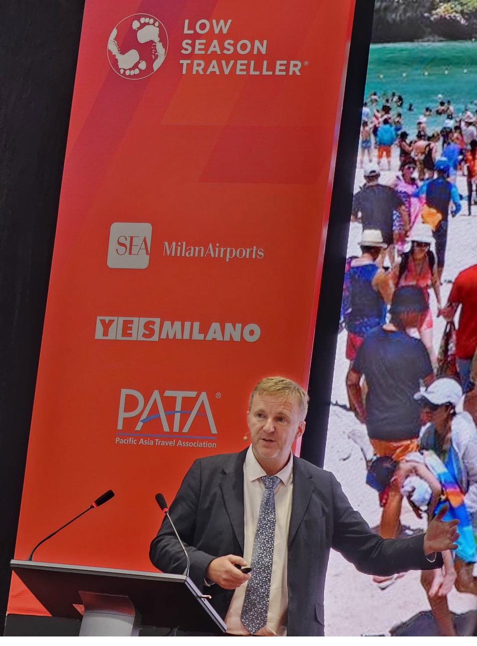 Ged Brown on stage with LST branding